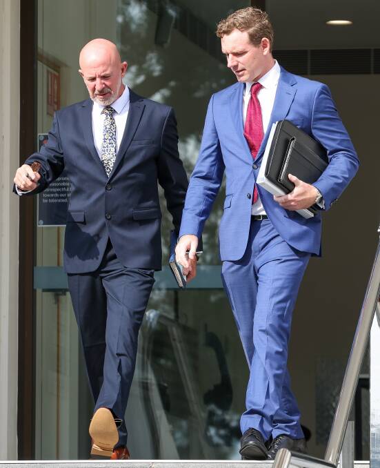 Robert Brian Grubb leaving Wollongong courthouse alongside his lawyer James Howell on April 17. Picture by ACM