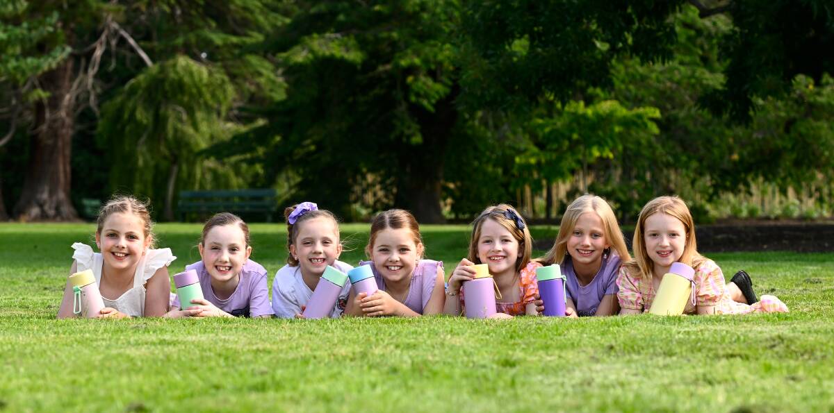 Tweens Ella, Sofia, Alessia, Taya, Charlotte, Ginger and Madeline with their Frank Green drink bottles. Picture by Adam Trafford