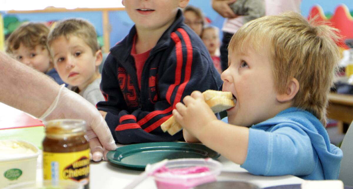 Kids eating Cheesymite sandwiches in Devonport. File picture