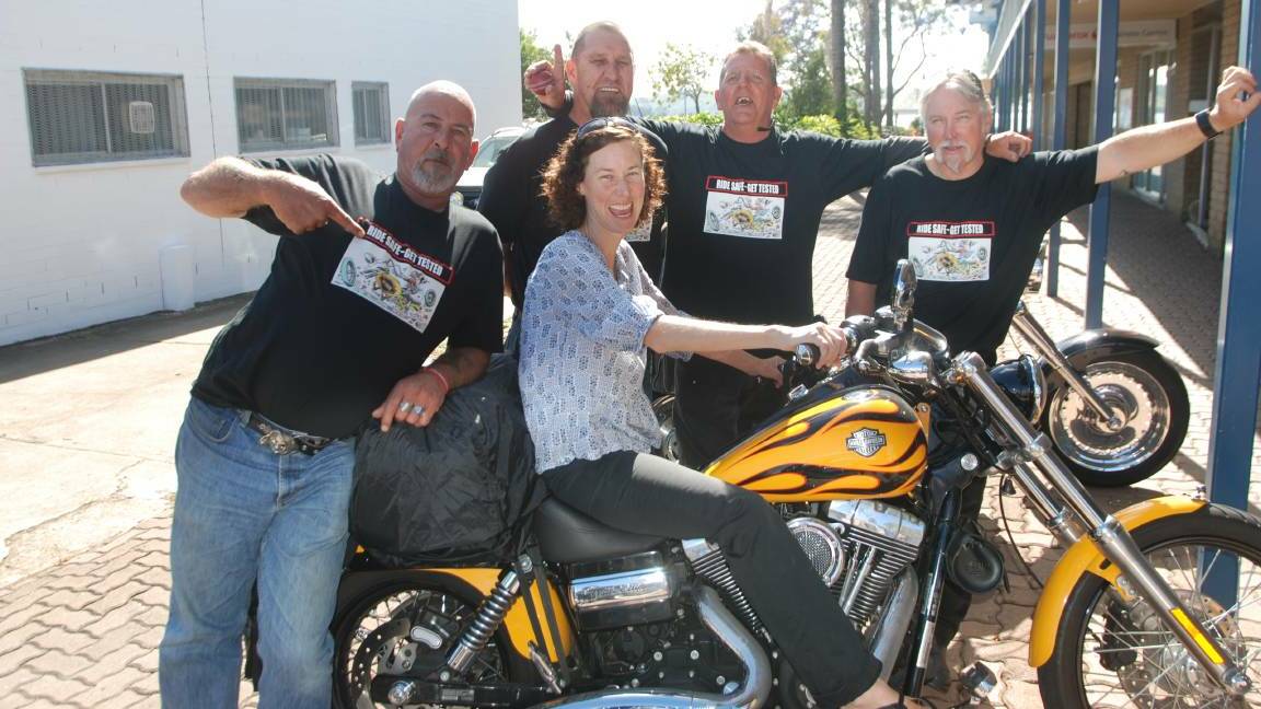 BACK AGAIN: In 2014, Peter Schmidt, Geza Belley, Dale Holland and Dave Candy, with Southern NSW Medicare Local representative Nina Holland, visitedn Batemans Bay to promote HIV testing. They return on November 27, 2015.