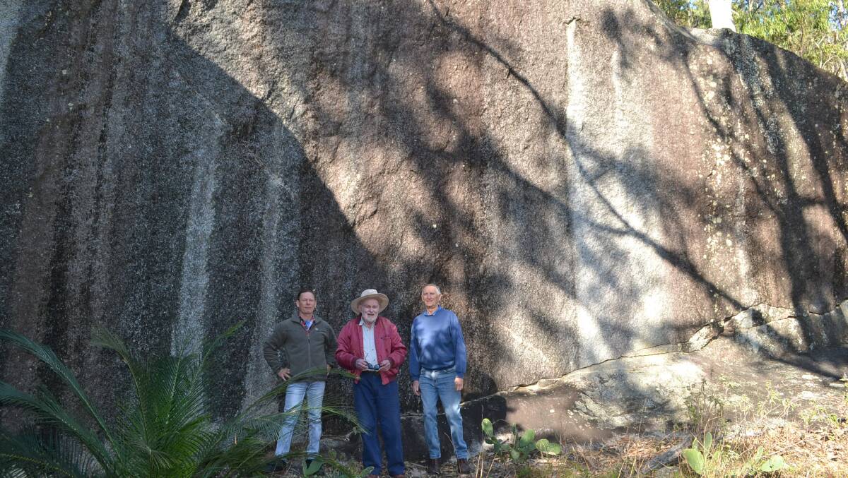 ROCKY HISTORY: Moruya historian Norman Moore centre with fellow Moruya residents Steve Dean and John Brown at the site of Joseph Louttit's quarry at Moruya South Head. 