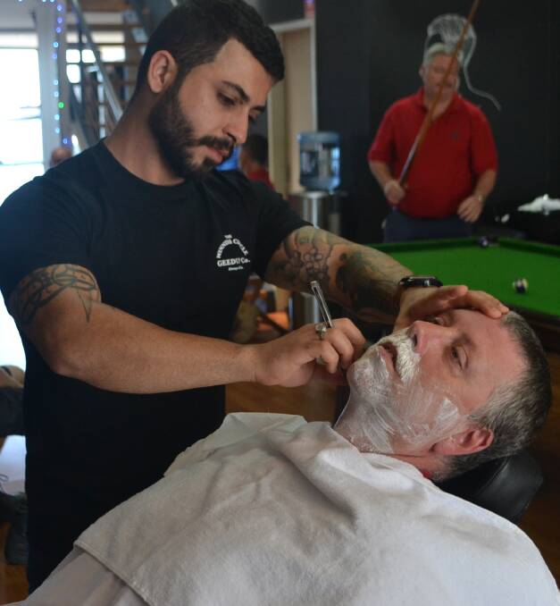 MO GO: Barber Ash Zad removes Rob Ellis's impressive Movember fundraising growth.