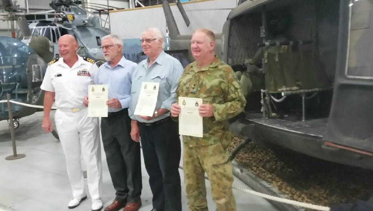CHOPPER CHAP: Lt George "Joe" Ralph (right) is awarded his Vietnam Gunners Wings at HMAS Albatross in Nowra along with Ted Wynberg, John Washburn and Terry Hetherington. 