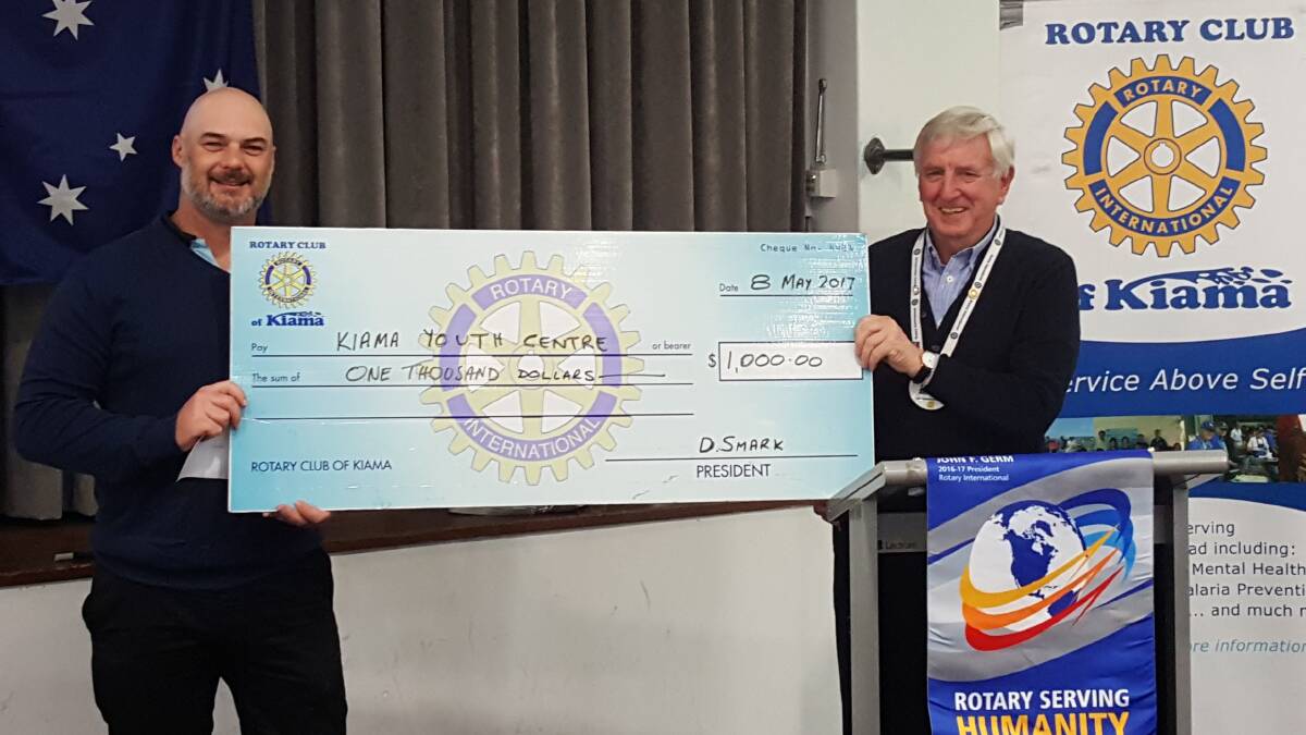 Kiama Youth Centre’s senior youth worker Andrew Chatfield, receives a cheque from Rotary Club of Kiama acting youth director Mal Bracken.