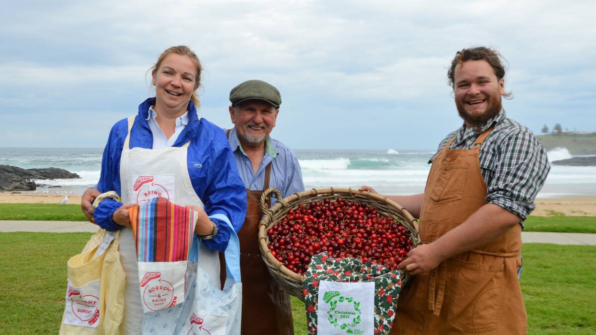 Camilla Kerr-Ruston from Kiama Boomerang Bags, Yuri Hulak and Alex Hulak with the giant basket of cherries.