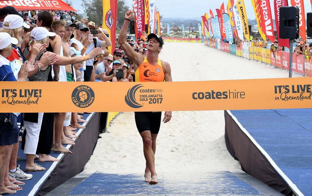 Ali Day wins a record-equalling fifth Coolangatta Gold earlier this month. Picture: AAP Image/Dave Hunt.