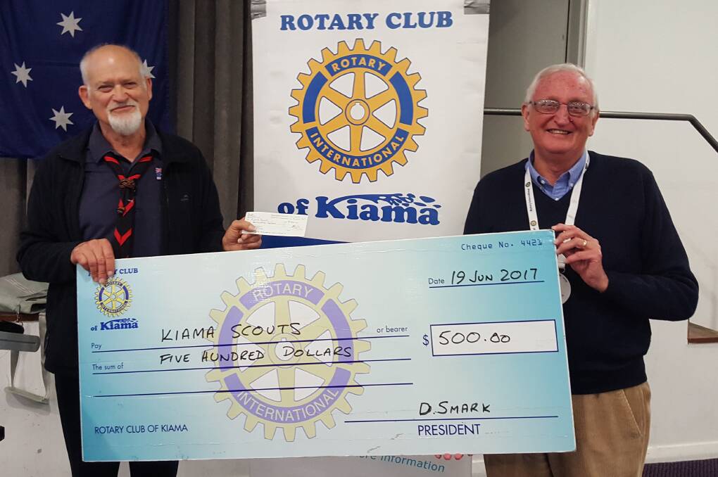 Group Leader Greg Crofts, Kiama Scouts receiving a cheque from President Dave Smark, Rotary Club of Kiama.