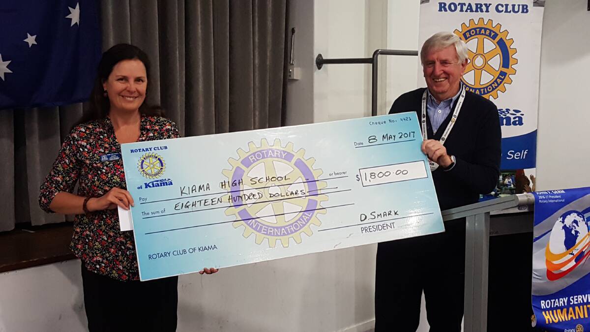 Kiama High School’s Wellbeing and Engagement teacher Jane Littrich receives a cheque from Rotary Club of Kiama acting youth director Mal Bracken.