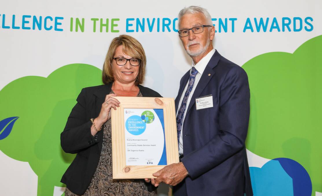 RECOGNITION: Josephine St John receives the Local Government NSW Community Waste Services Award from Barry Buffier. Photo: Supplied.