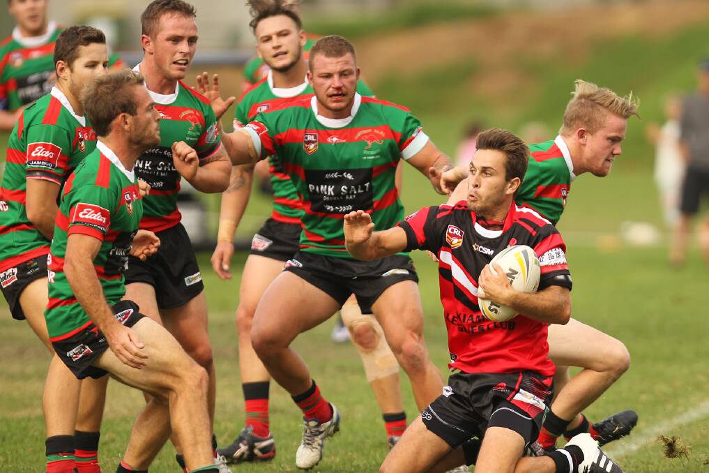 Kiama fullback Tom Atkins surrounded by a host of Jamberoo defenders during Saturday's 8-all draw at Jamberoo. Picture: DAVID HALL