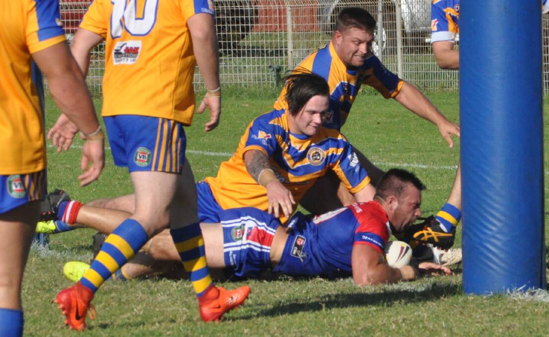 TRY TIME: Gerringong's Nathan Ford dives over to score one of his two tries in Sunday's victory against Warilla-Lake South. Photo: COURTNEY WARD