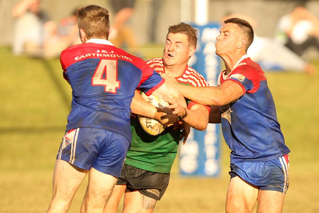 Jamberoo's Brandan Smith is tackled by Gerringong duo Toby Gumley-Quine and Rixon Russell. Photo: DAVID HALL