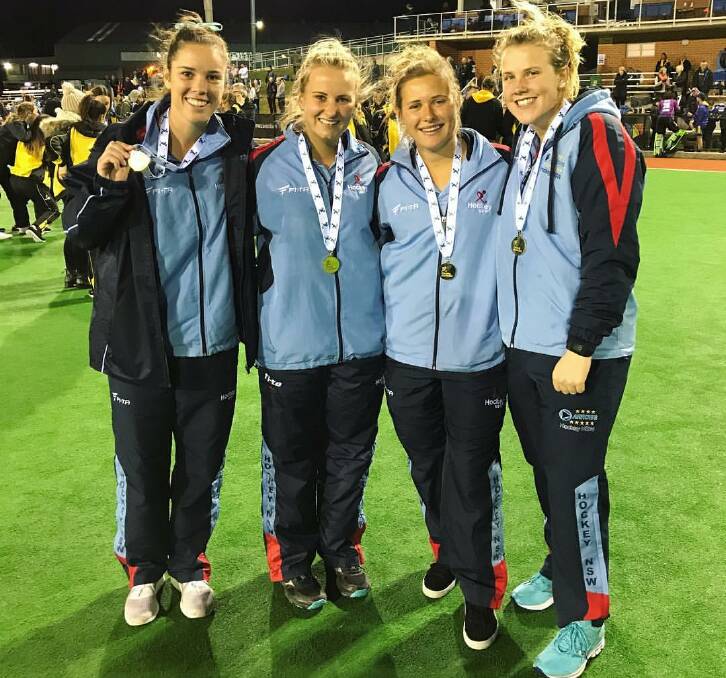 GOLDEN GIRLS: Gerringong's Grace Stewart with team mates Riley Smith, Kaitlin Nobbs and Andrea Gillard after being presented with their gold medals.