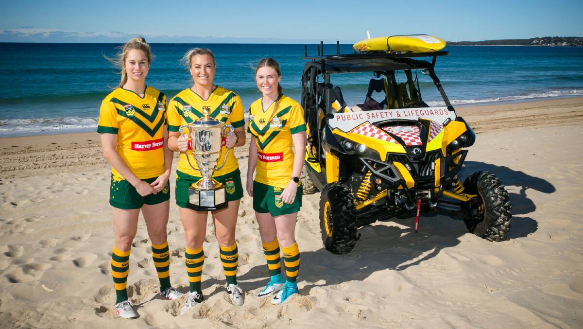 Jillaroos' Kezie Apps, Ruan Sims and Maddie Studdon at Cronulla Beach with Women's Rugby League World Cup trophy. Photo: Narelle Spangher
