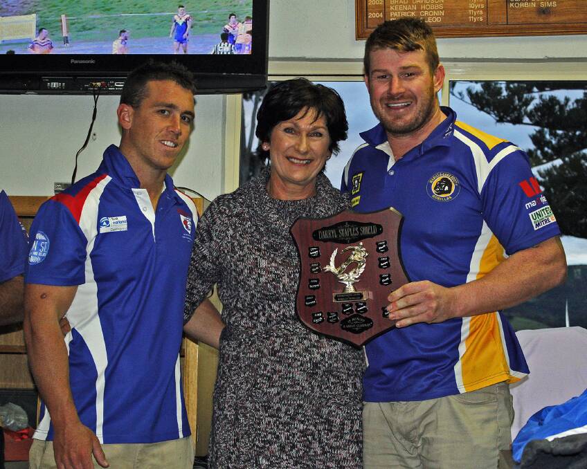 Lions' Rixon Russell and Gorillas' Andrew Doimei being presented the Darryl Staples Shield. Photo: GAME FACE PHOTOGRAPHY