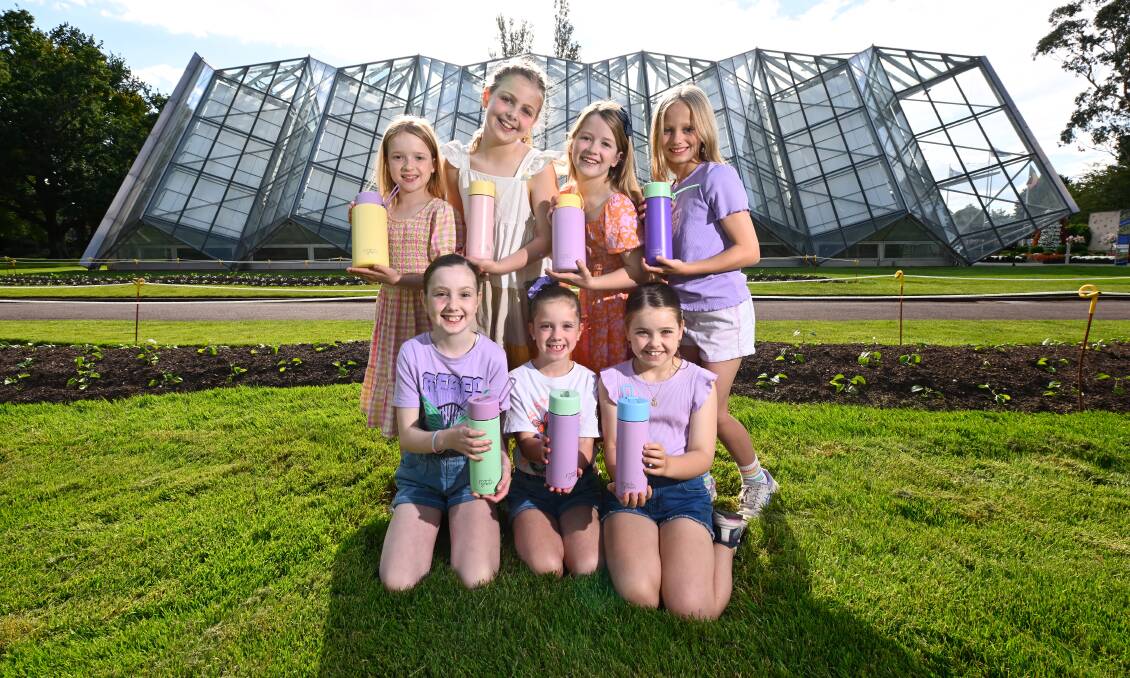 Back: Madeline, Ella, Charlotte and Ginger; front: Sofia, Alessia and Taya, all holding Frank Green drink bottles. Picture by Adam Trafford