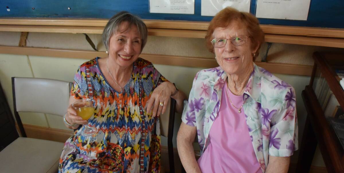 CELEBRATIONS: Val Day and Anita Borszeki attended the Kiama and District Historical Society Christmas drinks.  