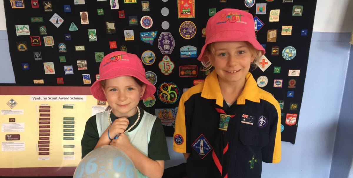 KEEN SCOUTS: Phoebe Glassner and Olivia Glassner at the Scouts' Open Day in Kiama, which offered a live pipe band for entertainment.  