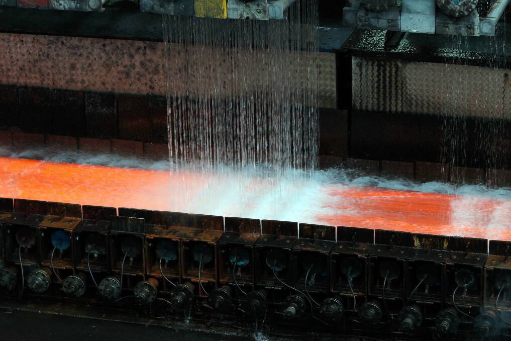 Hot strip steel being cooled at BlueScope's Port Kembla steelworks. Two Illawarra MPs have said it's time for the government to act on steel dumping. Picture: Sylvia Liber
