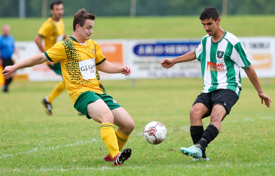 Shoalhaven's David Chicharo (left) fights for the ball during a recent game against Berkeley Sports. Picture by Adam McLean