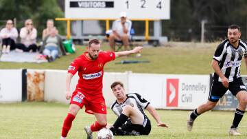 Wollongong United player Klime Sekukoski lines up a shot for goal against Port Kembla at Wetherall Park on Sunday. Picture by Anna Warr