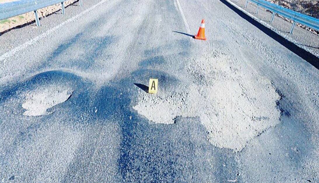 The Oallen Ford Road damage was 3.8 metres wide, 1.5m long and 11cm deep, a police scientific report revealed. This photo was taken on the day. 