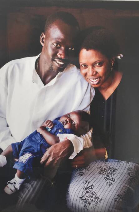 FAMILY: Elijah Buol with his wife Ashol and first born son Deng. Photo: Supplied