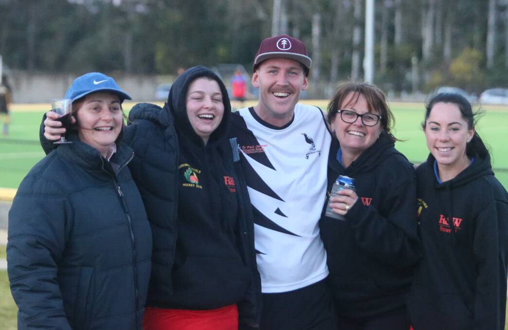 CULT FOLLOWING: The Block's Sticks poses for a photo with fans from the Burrawang woman's hockey team during last week's local hockey round.
