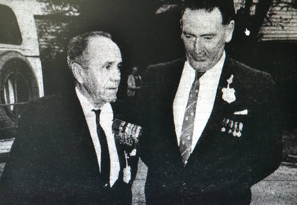 Lieutenant Joseph Maxwell VC MC and Bar DCM with Nowra RSL Sub-branch president Mr D.A. Elvy at the Memorial Gates at the Nowra Showground in 1965 after laying a wreath. Photo: Shoalhaven and Nowra News - Photographic Arts Studio.