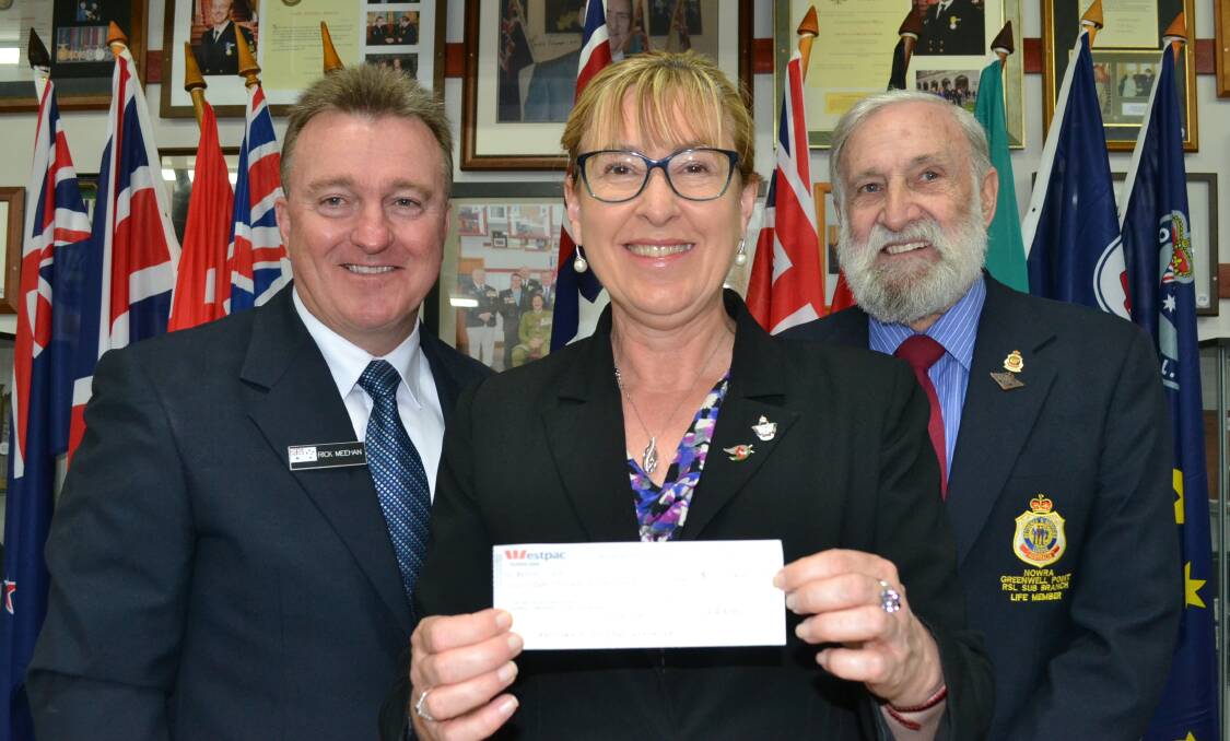 SUPPORT: Digger Day chairman and organiser Rick Meehan (left) and Nowra RSL Sub-Branch president Fred Dawson present $10,000 to DefenceCare general manager Robyn Collins raised from Digger Day.