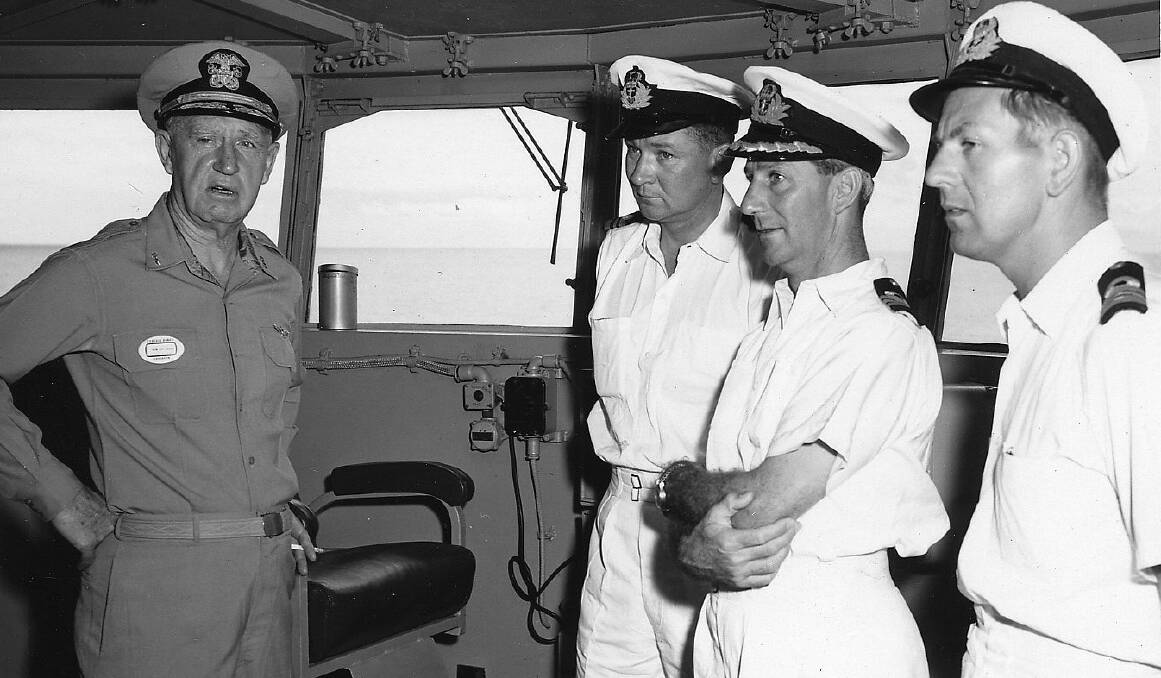 Fred Sherborne (centre with arms folded) onboard HMAS Melbourne in 1958.
