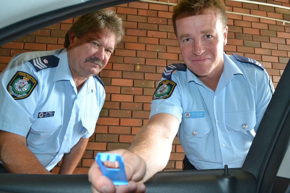 ON THE ROAD: Commanding officer of Shoalhaven Highway Patrol, Sergeant Mick Tebbutt (left) and Leading Senior Constable Adam Cooper with the mobile drug testing equipment.