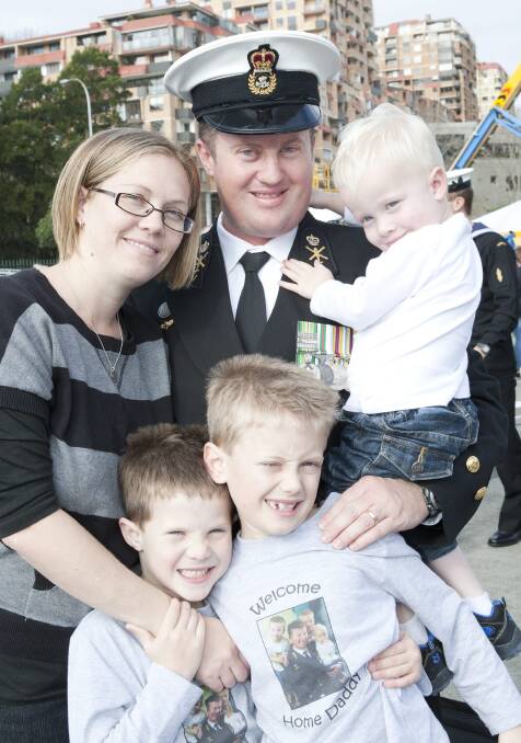 Warrant Officer Gordon Davis with his wife Jacinta and sons Liam, Mitchell and Ashton.