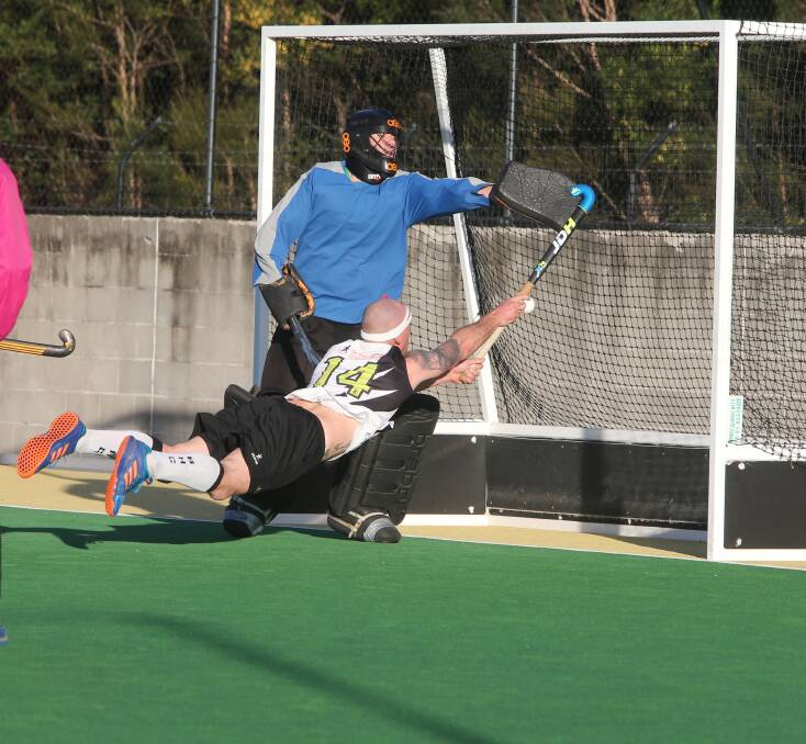 FLYING HIGH: Sticks, Berry Blacks' Mark Croker, back from The Block, gets airborne in an attempt to score a goal in last week's round of Shoalhaven Hockey.