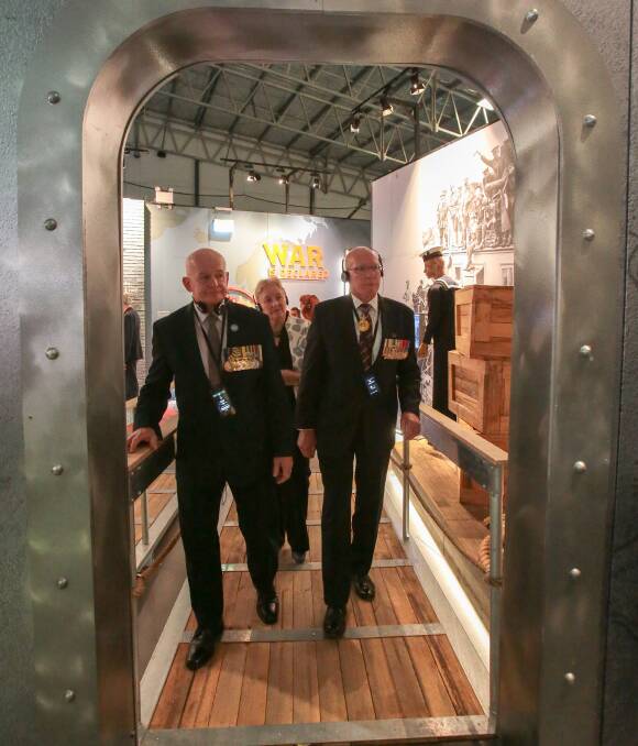 SPIRIT OF ANZAC: NSW Governor general David Hurley, Brian Dawson and member for Gilmore Ann Sudmalis walking through the free interactive exhibition on at UOW Sports Hub until January 20. Picture: Adam McLean