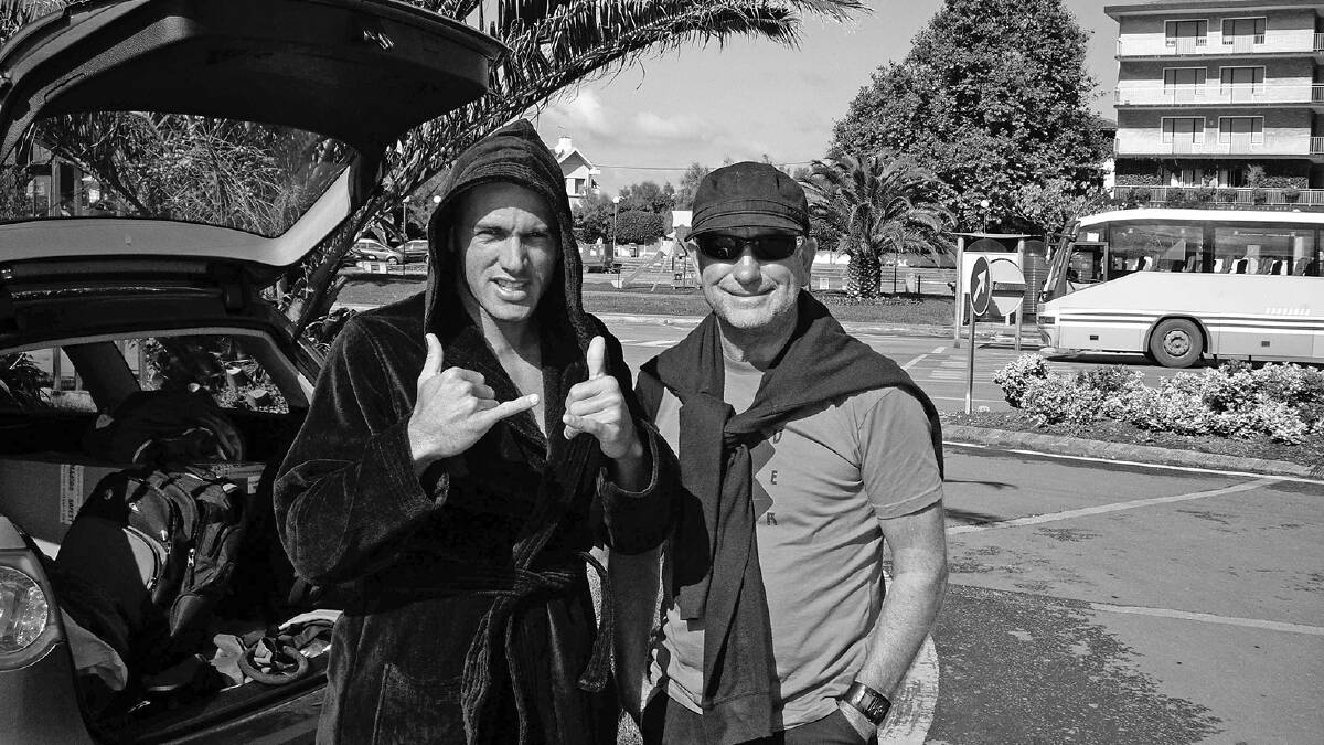 Phil Jarratt with Kelly Slater. Phil has received the Australian Surfing Hall of Fame Media Award three times and has won numerous other awards for his work. Phil has also worked within the surf industry both for Rip Curl and Quiksilver in the US, Australia and Europe. Picture: Supplied