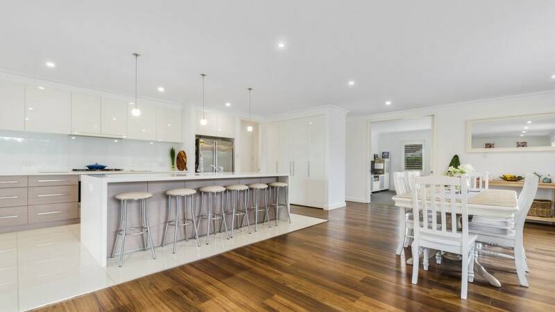 ON TREND: Entertaining is driving households to want bigger kitchens which meld into the dining room and outdoor living. Picture: Ray White Mittagong