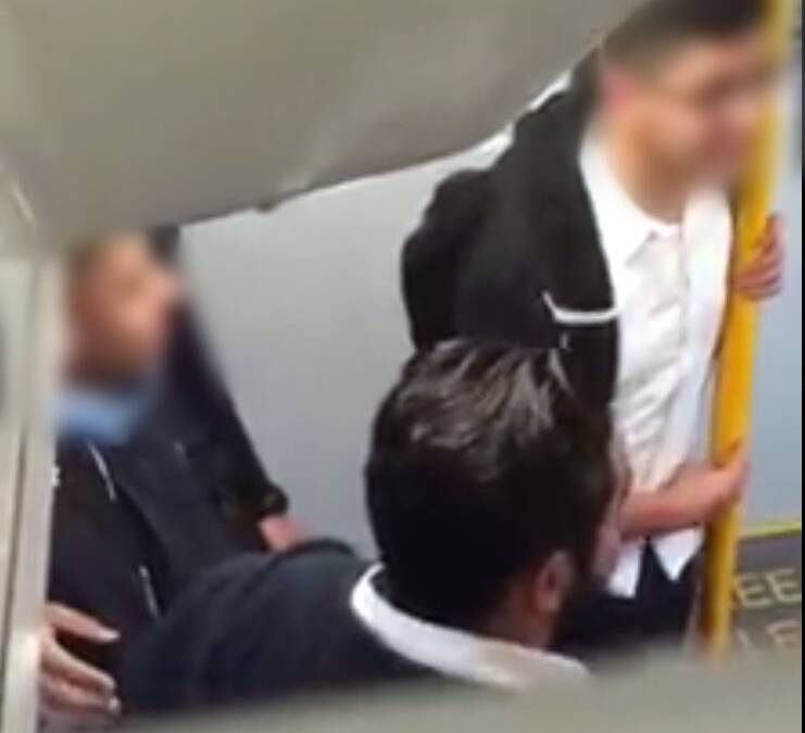 Suspended: Students were captured mocking a disabled young man on a train on Monday. Picture: Supplied.