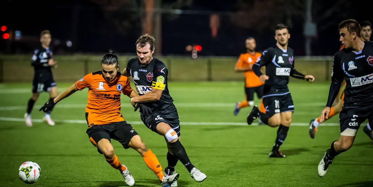NO JOY: Wolves skipper Chris Price battles for possession in Wollongong's 0-0 draw with Blacktown Spartans. Wollongong meet APIA Leichhardt at home next Sunday. Picture: FOOTBALL NSW/GEORGE LOUPIS