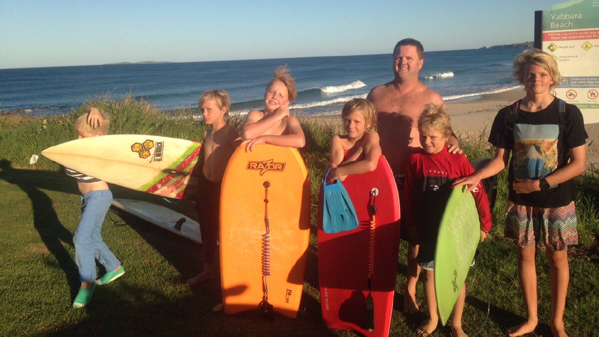 OUT OF WATER: Dean Loudoun and the kids on Yabarra Point, Dalmeny after getting out of the water after the shark sighting around 3pm Saturday. 