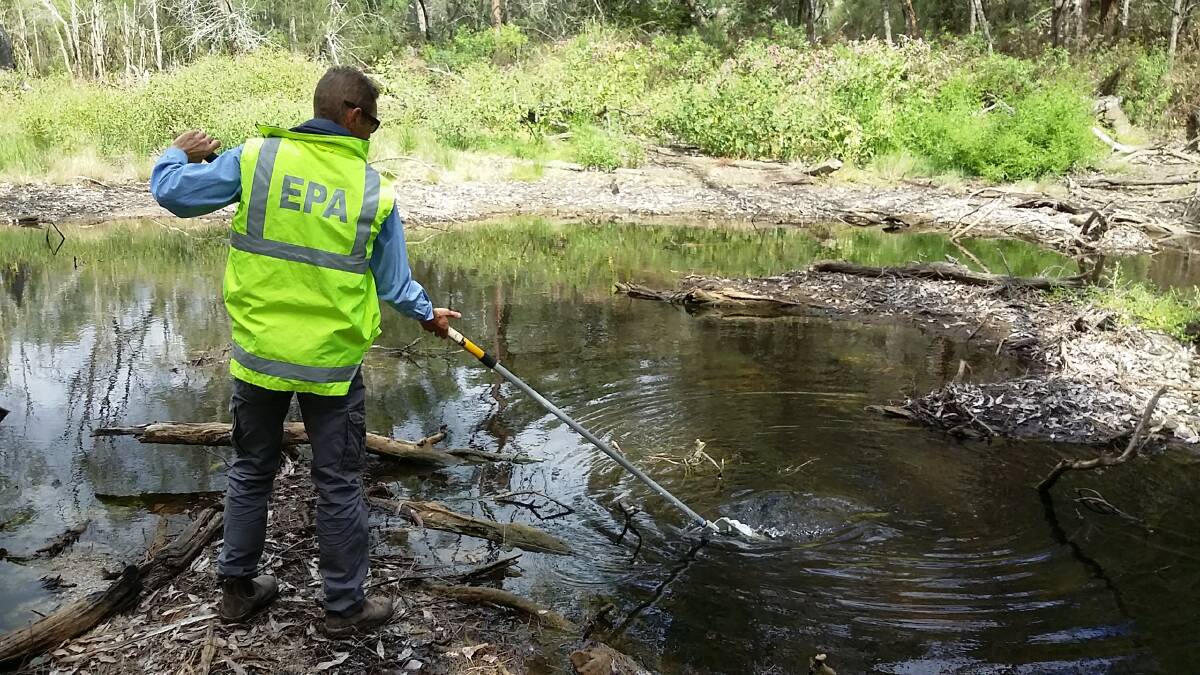 NSW EPA Officer undertakes water quality testing in Whittakers Creek north of Narooma. 