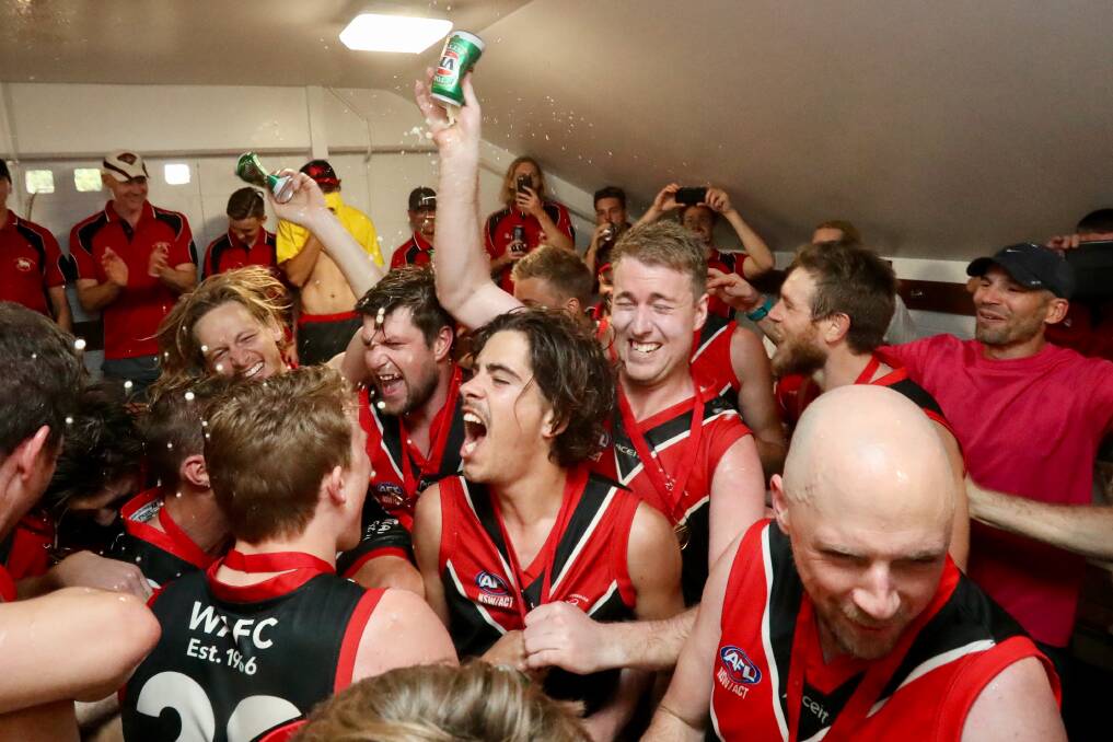 Party time: Lions players celebrate after signing the team song at North Dalton Park on Saturday. Picture: Adam McLean