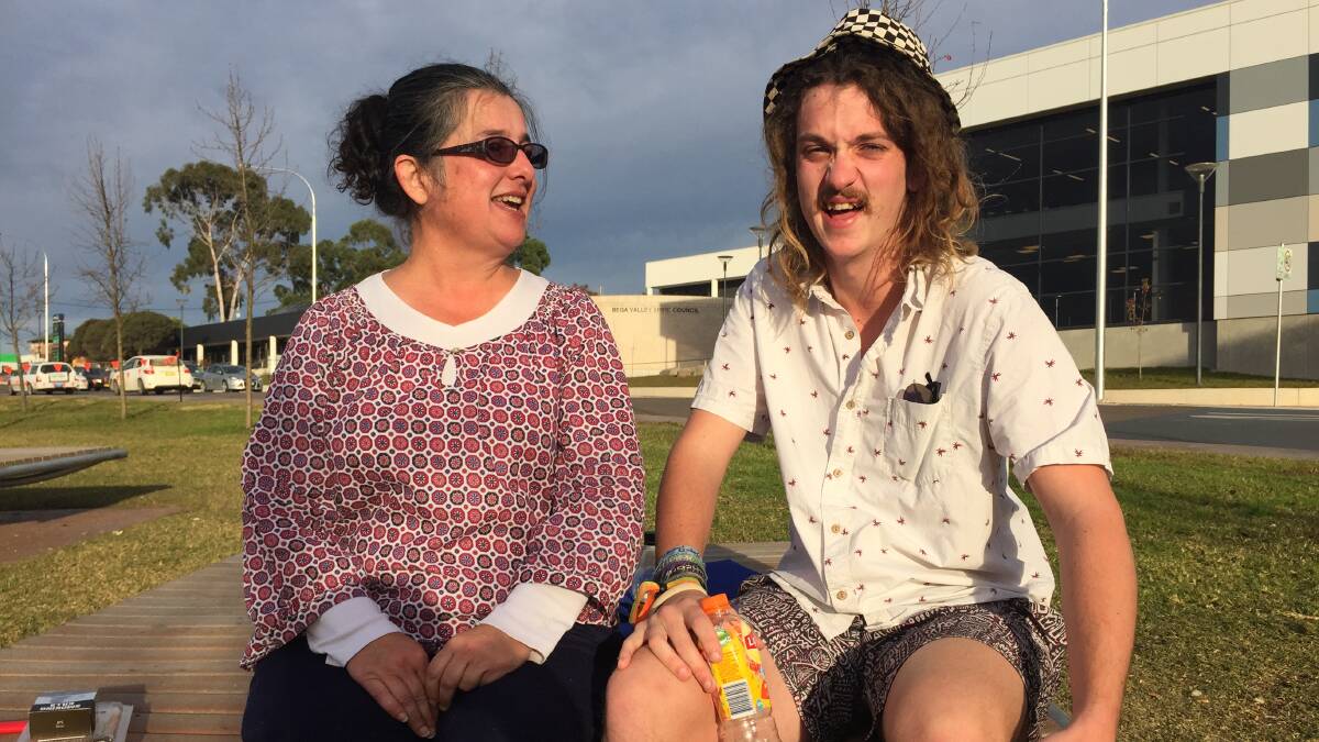 Bega's Henrietta Waddington and son Joe Walker were happy to see something in the gardens that brought a positive feeling after the recent destruction.