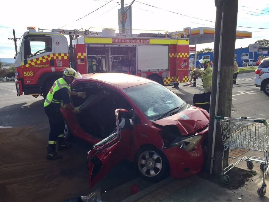 Woman trapped in West Wollongong crash