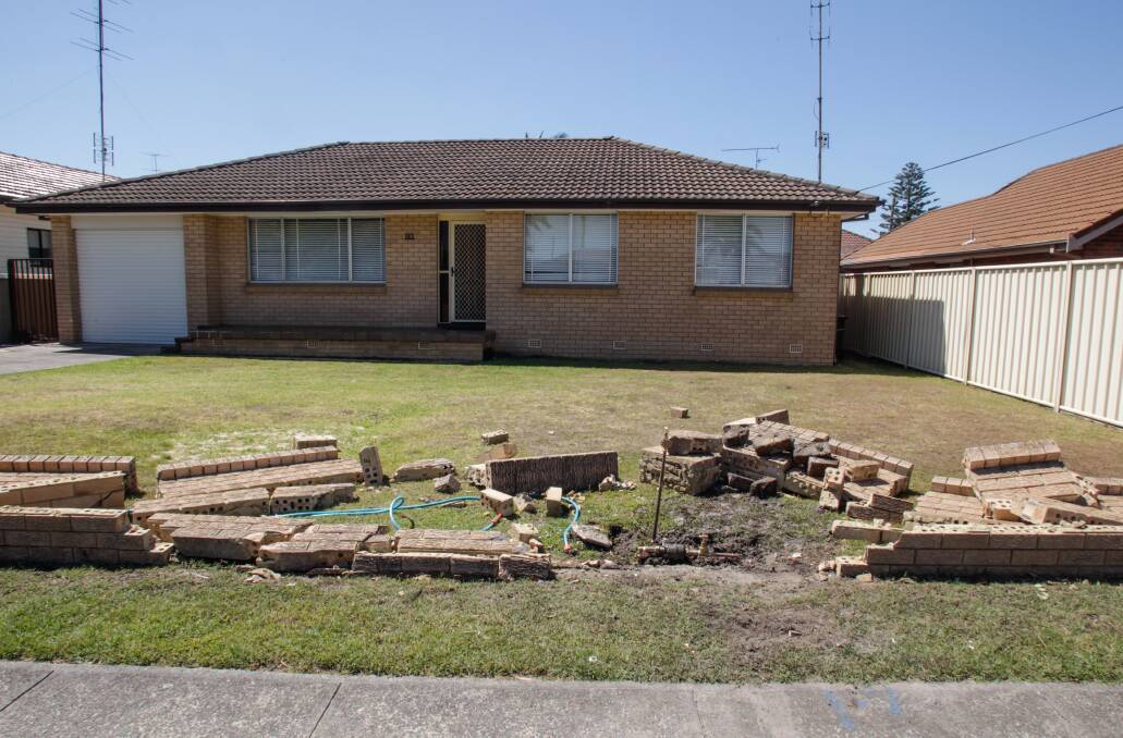 The brick fence of a property at 165 Windang Road was destroyed in Saturday's crash. Picture: Georgia Matts