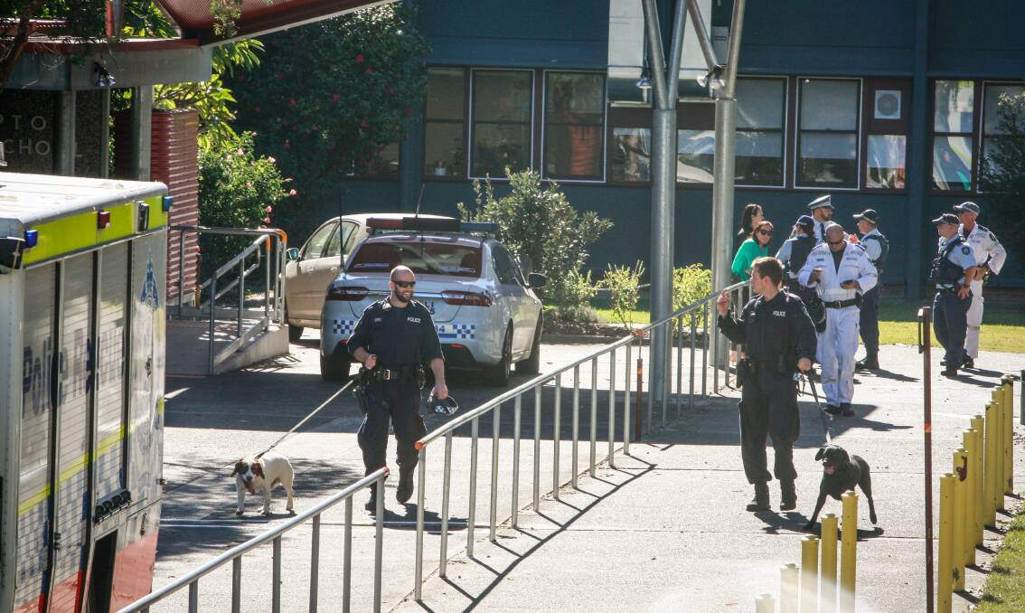 LOCKDOWN: A scene from Tuesday's search at Dapto High school. Picture: Georgia Matts.