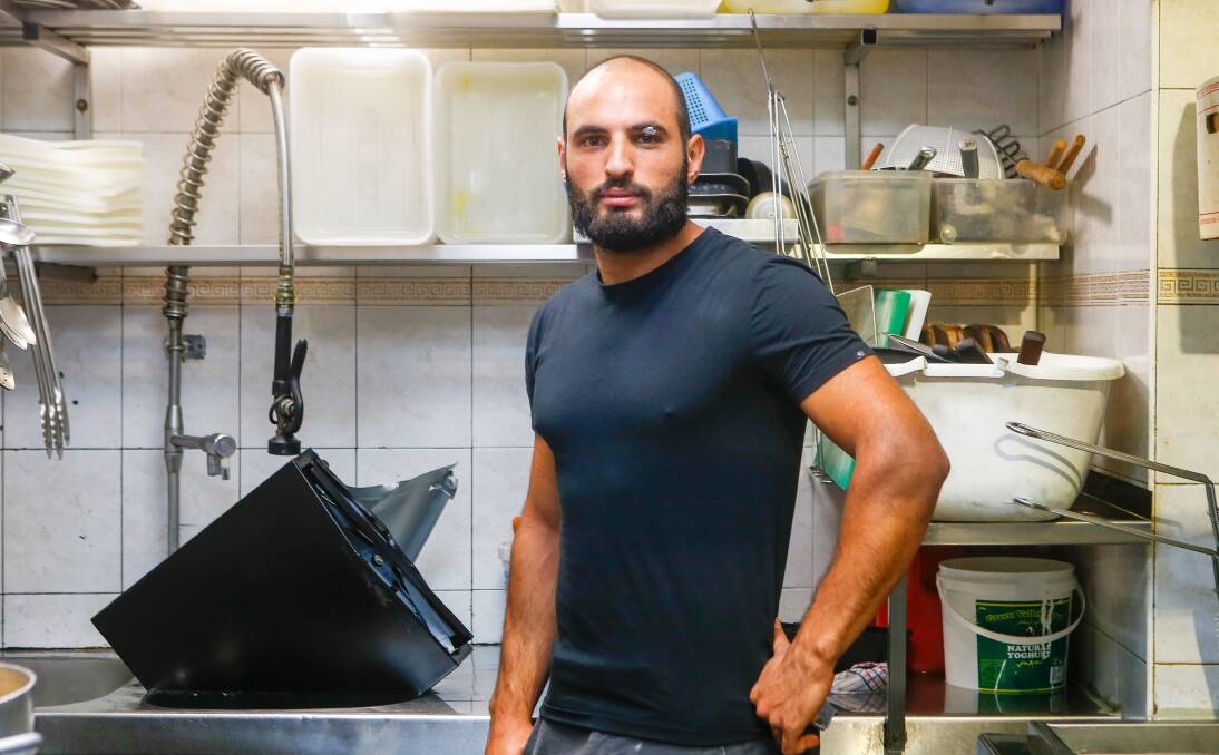 SABOTAGED: Electronic equipment essential to the restaurant's operation was submered in the kitchen sink. The attack interfered with the restaurant's trade on Thursday as Omar Nemer worked to restore the systems. Picture: Adam McLean