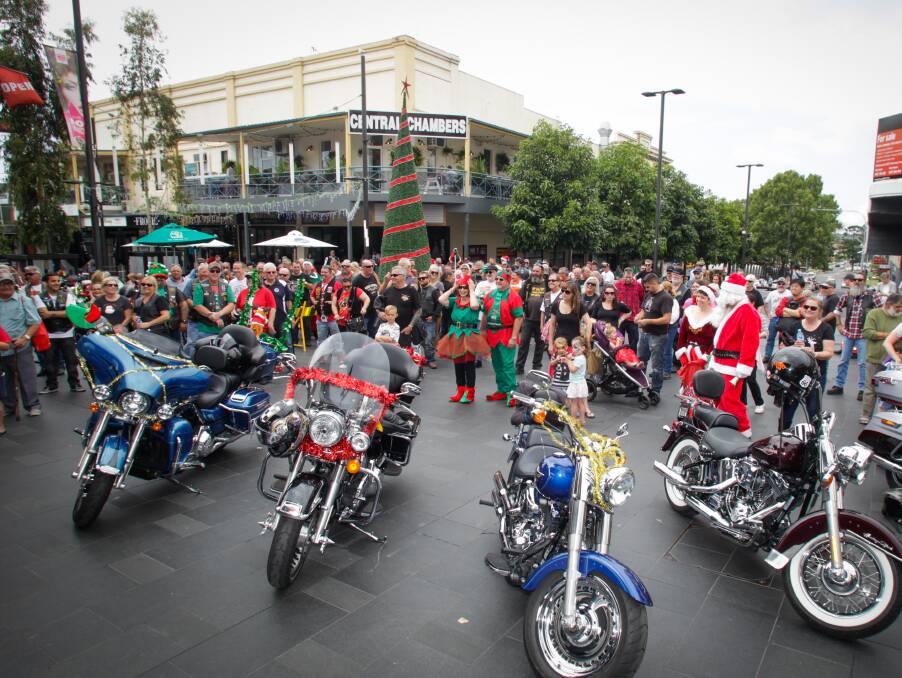 SHINY: Around 120 motorcycles rode up Crown Street in procession to park themselves, and presents, near the Giving Tree. Picture: Georgia Matts