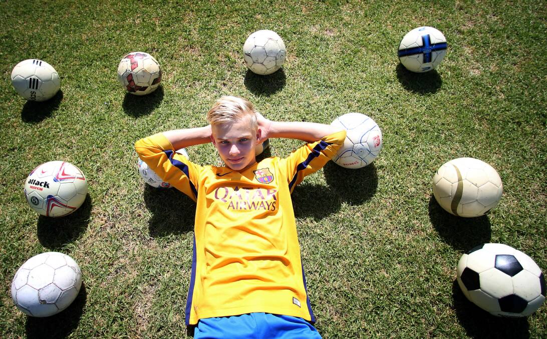 BALLING AROUND: Lachlan Rowe, 15, is passionate about soccer, collecting soccer balls and will do soccer clinics at a small African school to encourage community spirit instead of violence. Picture: Sylvia Liber