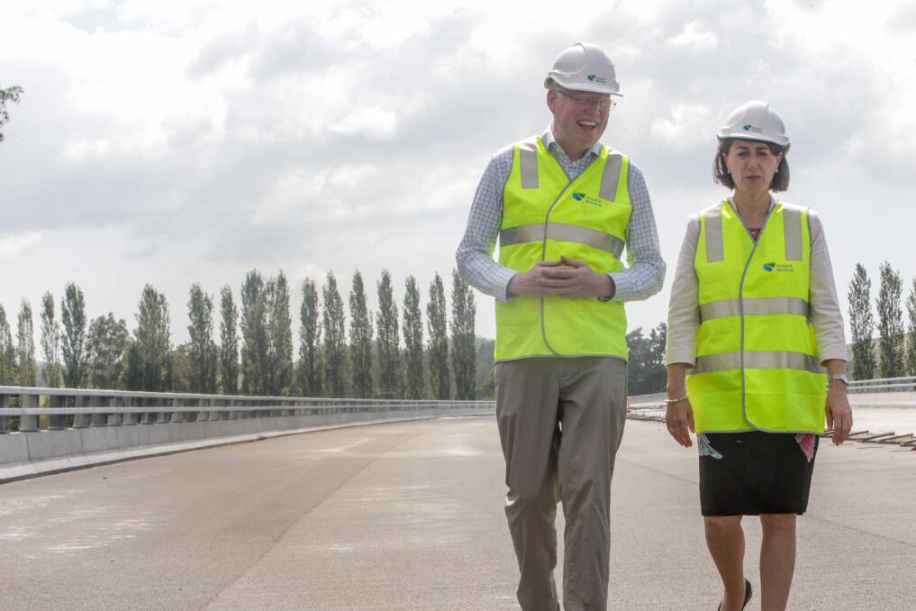 Kiama MP Gareth Ward with NSW Premier Gladys Berejiklian at the Berry bypass. Mr Ward has continued calls for more funding for the third stage of the Princes Highway upgrades. Picture: Georgia Matts